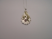 Silver & 18ct gold pendant with pink Sapphire