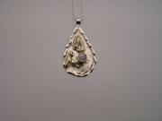 Silver & 18ct gold pendant with very pale lilac Sapphire